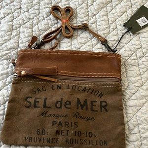 Myra crossbody leather and canvas bag .